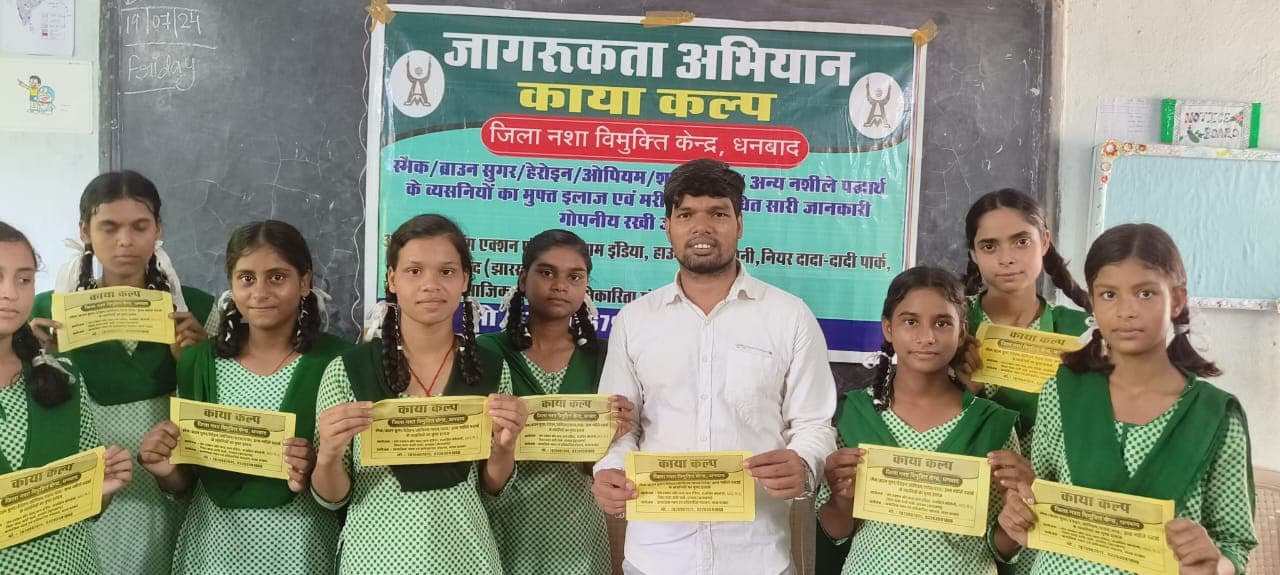 Students receiving IEC materials at school