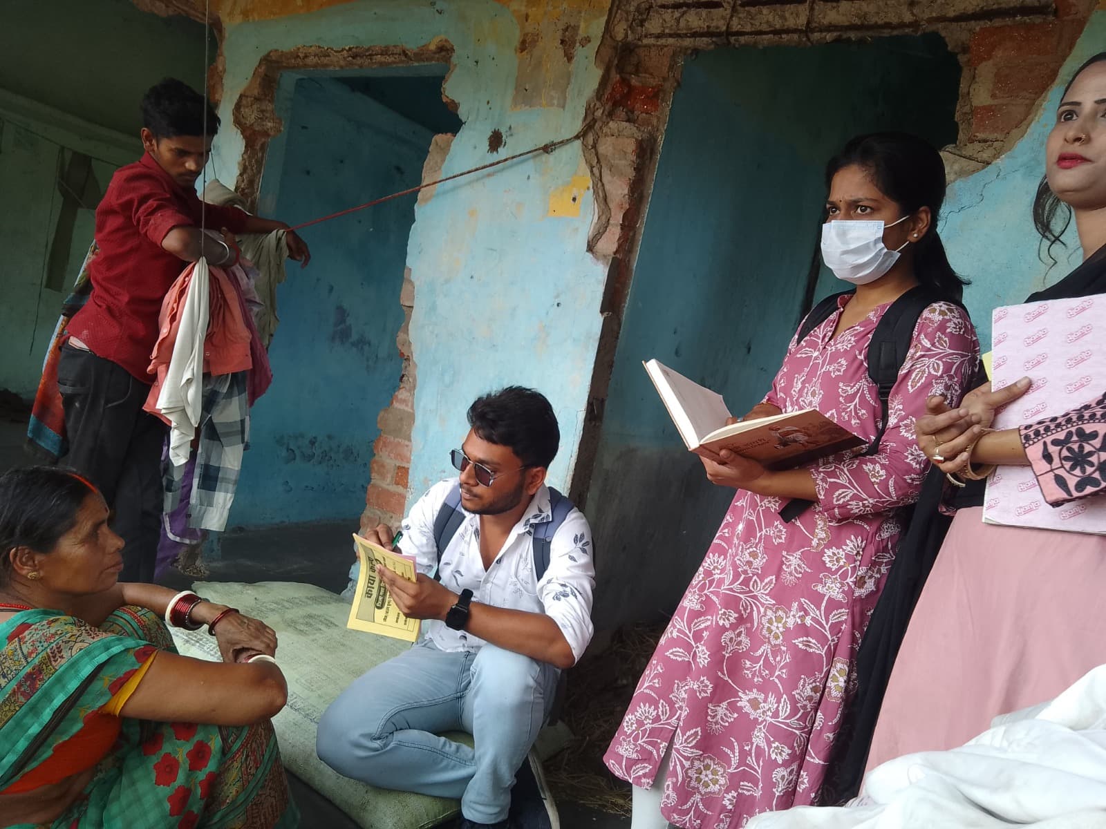 KAYA KALP outreach worker visiting community members