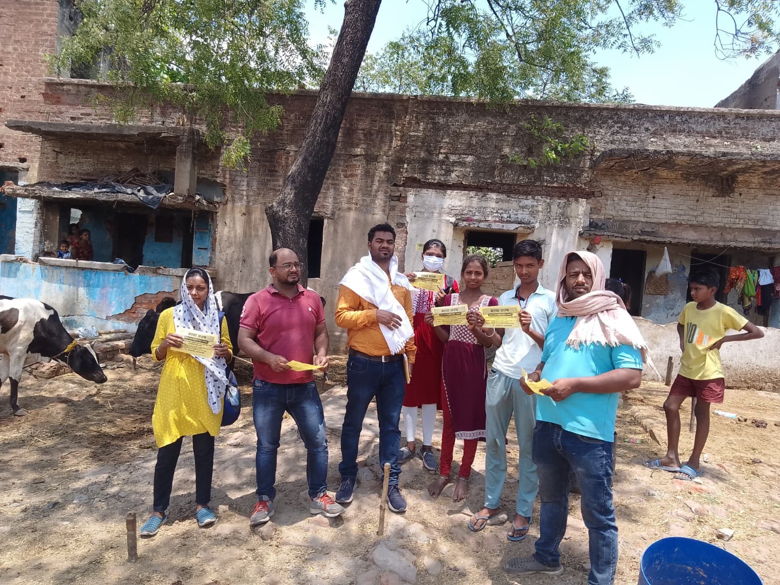 KAYA KALP health outreach — IEC materials distribution in village
